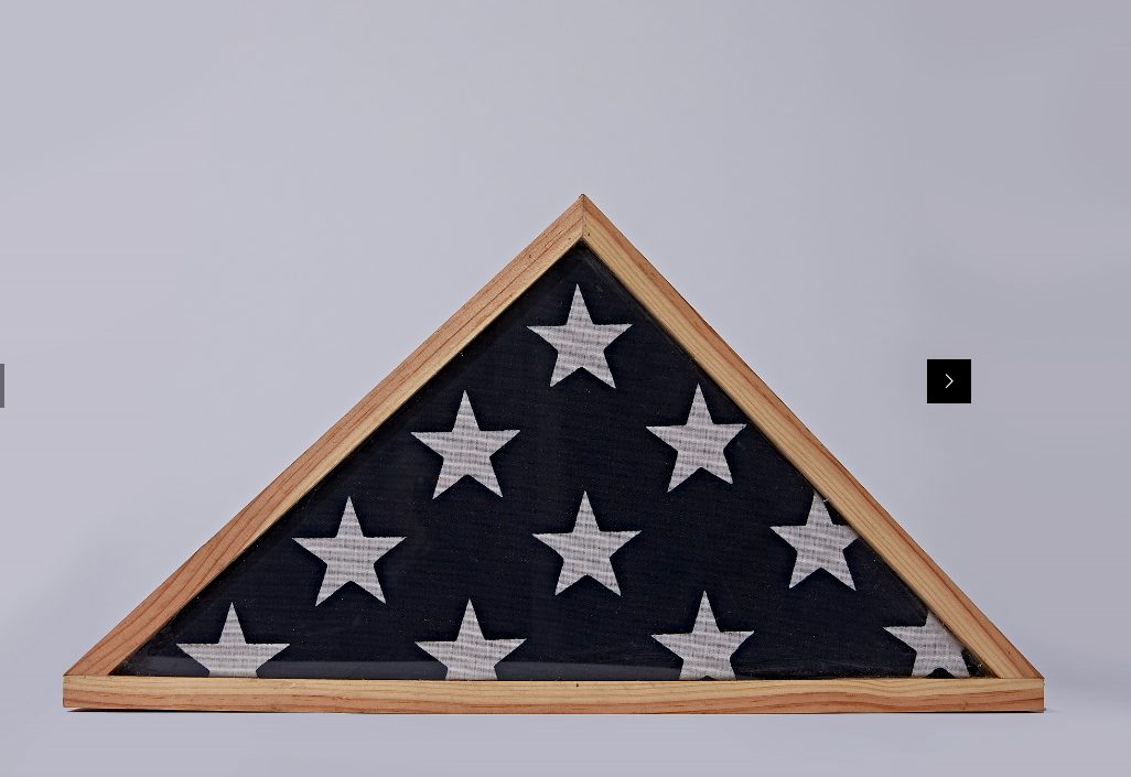 An american flag in a wooden triangle frame