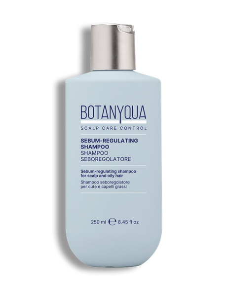 Flacone blu di shampoo regolatore del siero Botanqua con tappo argentato su sfondo bianco.