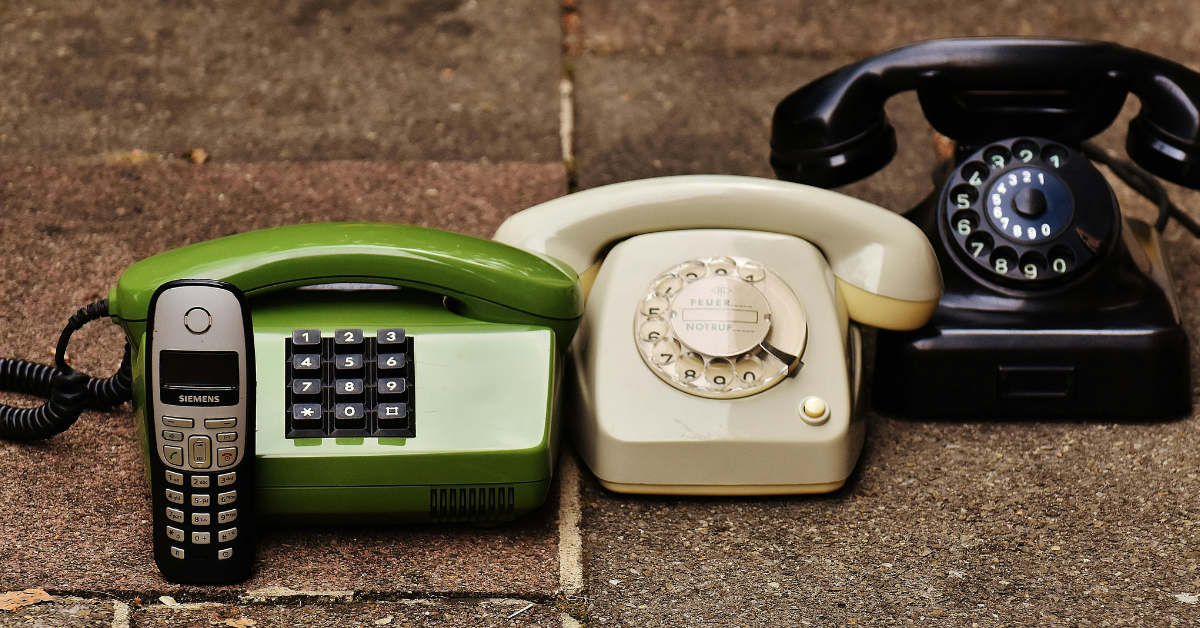 Collection of vintage landline phones showing the evolution of POTS technology