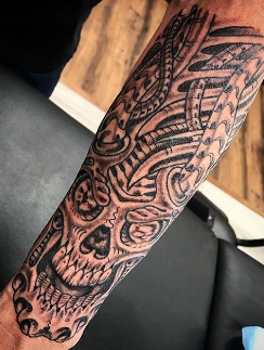 Black and gray bio-mech and skull tattoo by artist Jason Hobbie at Absolute Art Tattoo