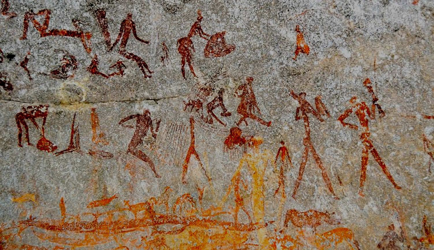 Cave painting of stick-figure humans in various poses, ochre-colored figures on a rock surface.
