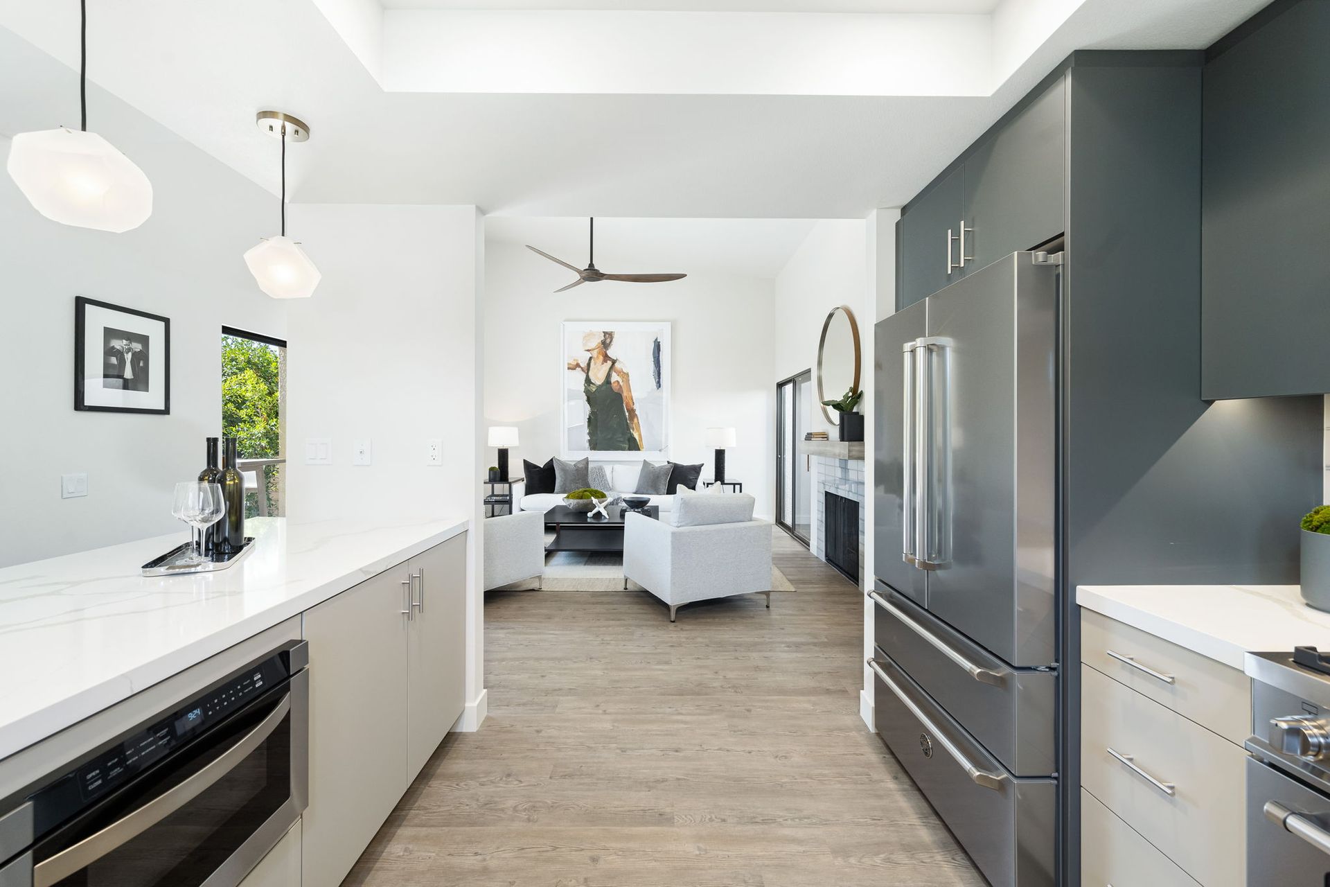 A kitchen with stainless steel appliances and a refrigerator
