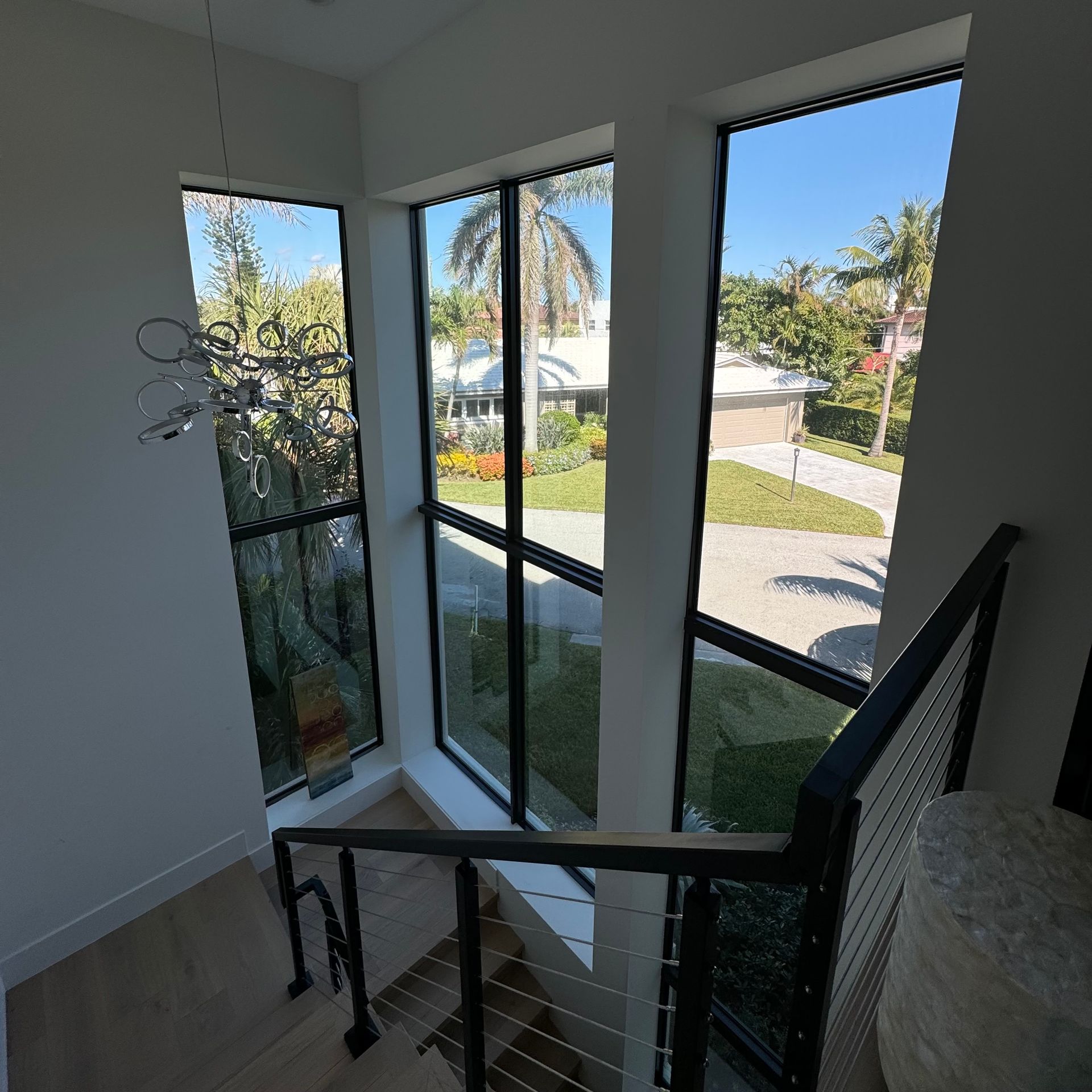 A staircase in a house with lots of windows