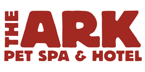 A red logo for the ark pet spa and hotel