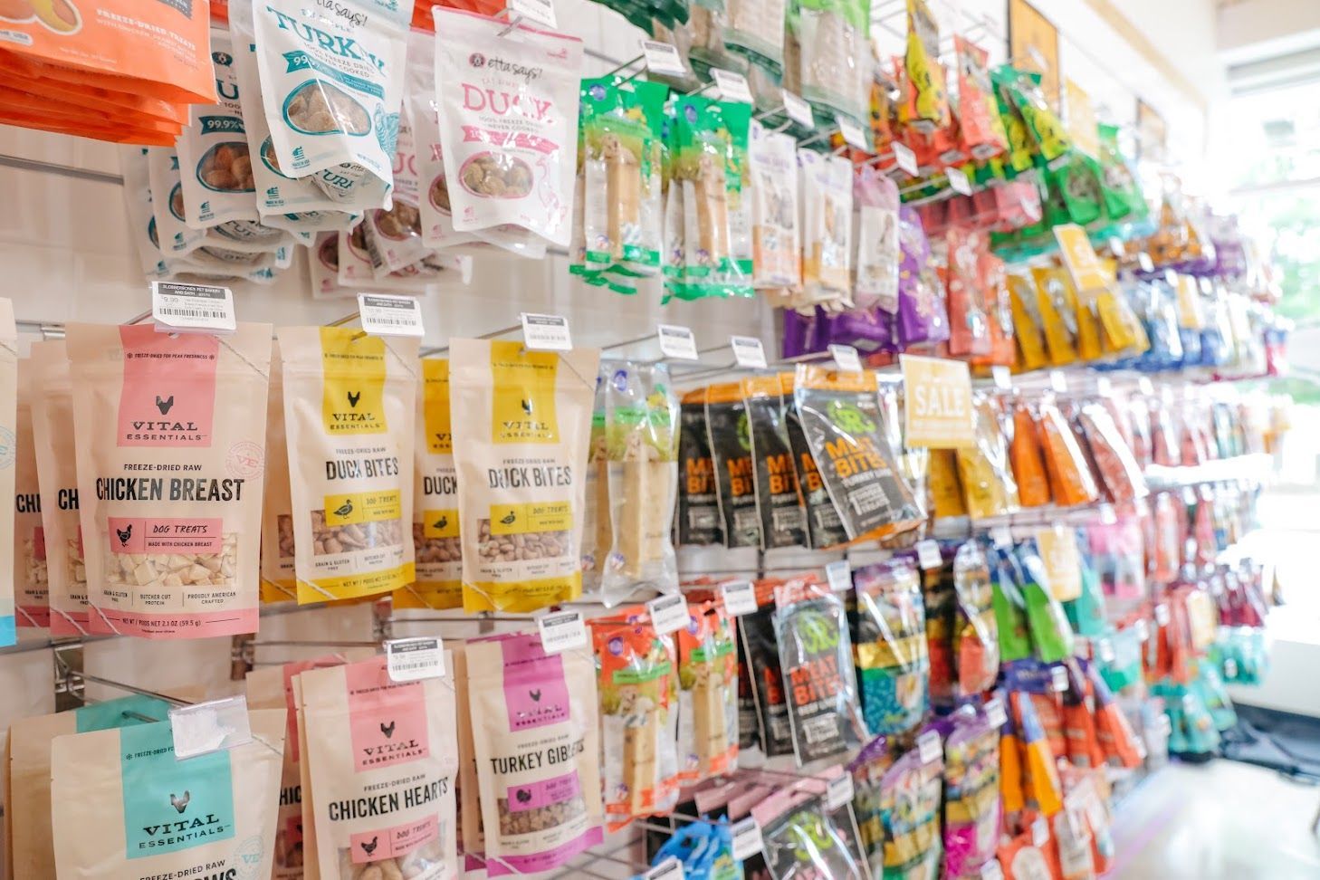 A store filled with lots of different types of dog food.