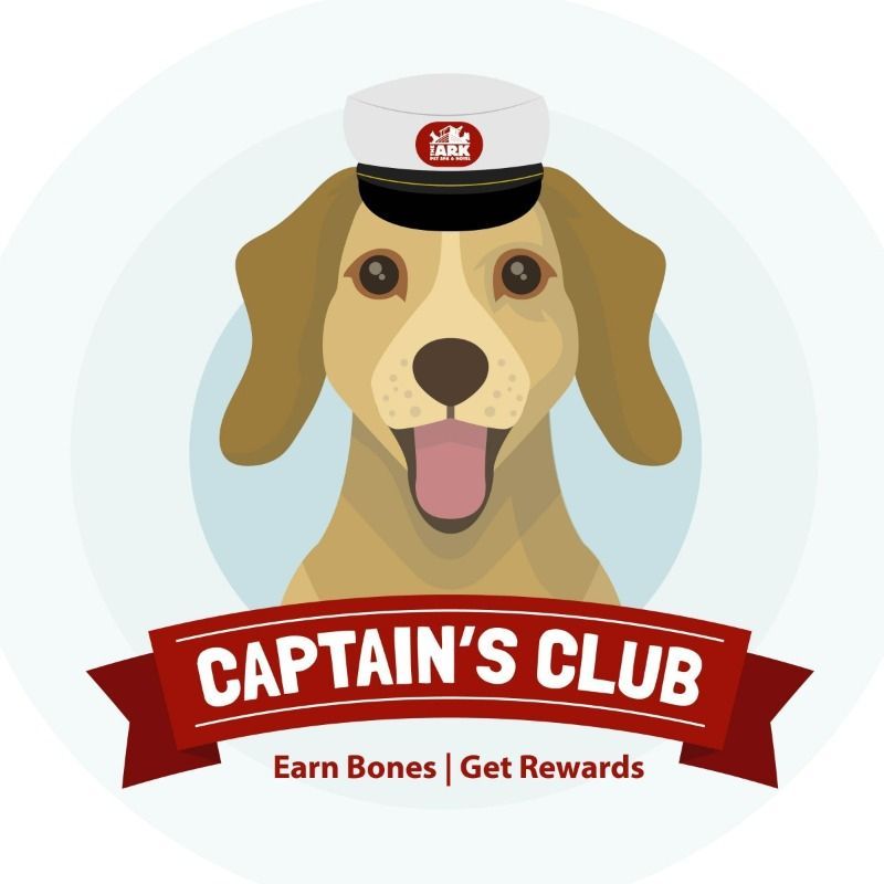 A captain 's club logo with a dog wearing a hat