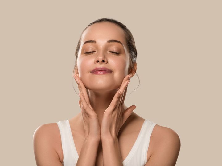 healthy skin woman touching her face