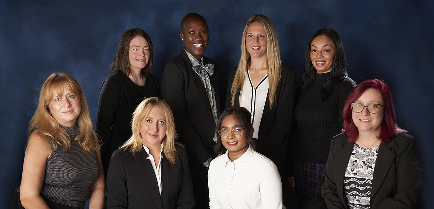 A group of people are posing for a picture together.