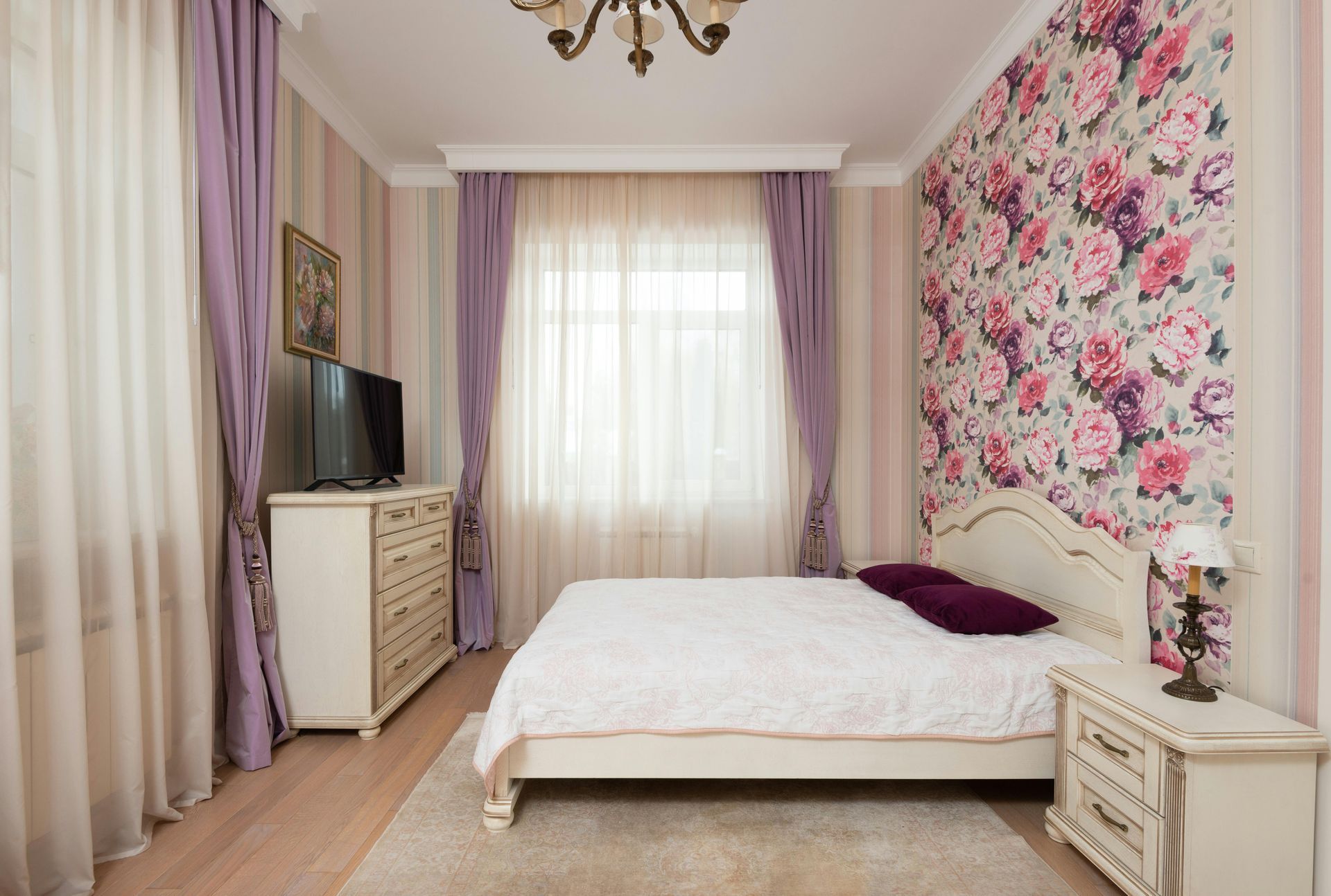 small bedroom with flower-design wallpaper