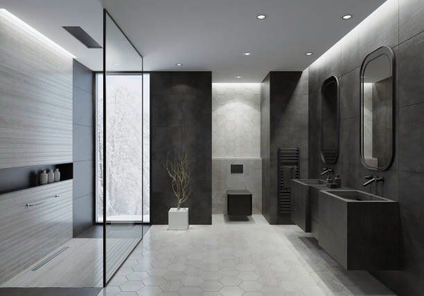 Modern, dark bathroom. Gray walls, large shower, black vanity, and hexagonal floor tiles.