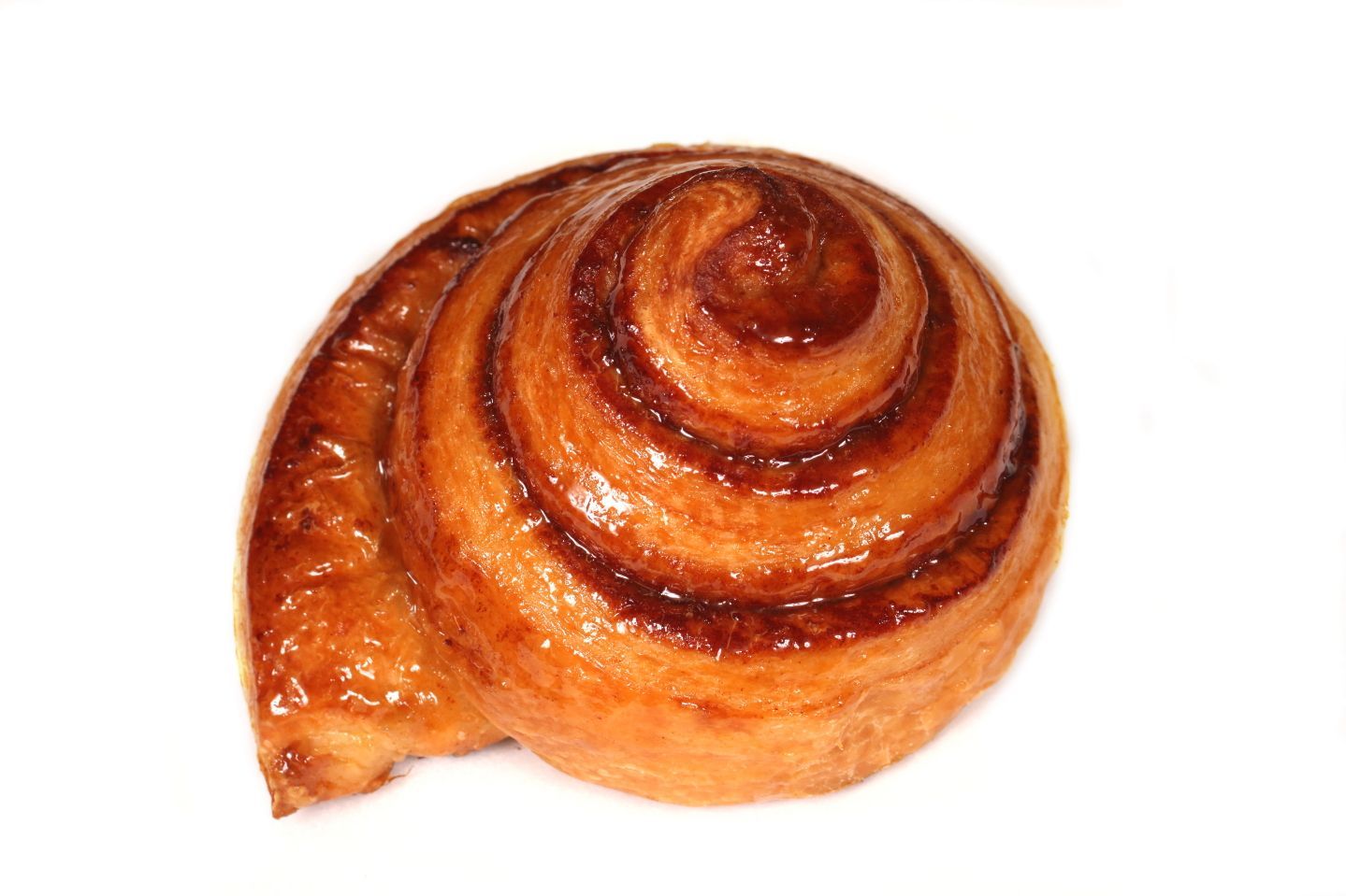 Cinnamon roll pastry with a swirl pattern, golden brown color.