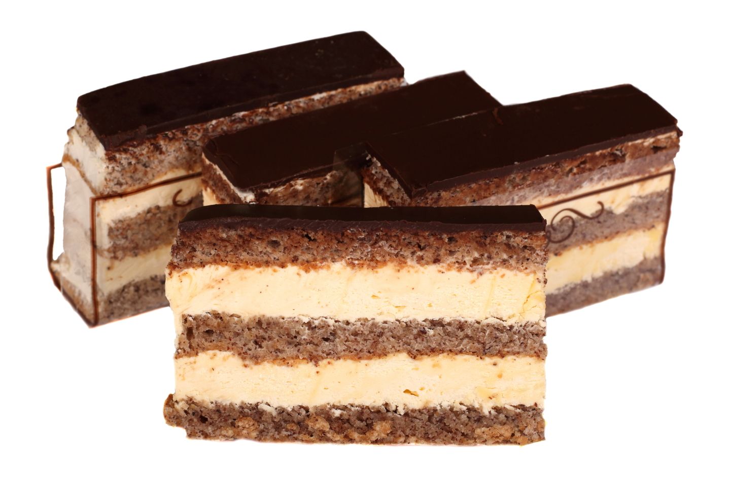 Chocolate cake slices with layered cream filling and dark chocolate topping.