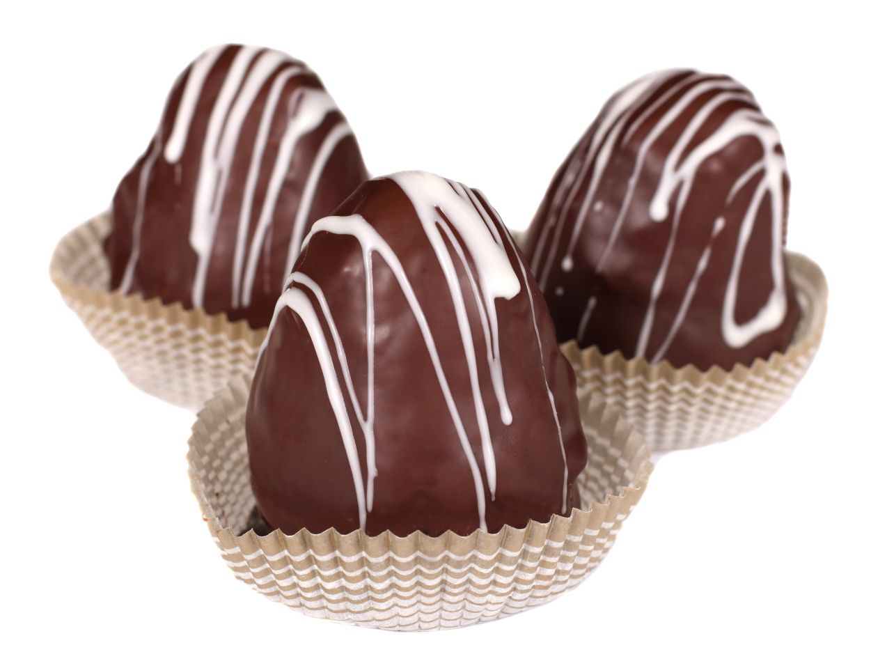 Three heart-shaped chocolate treats, drizzled with white icing, in paper cups.