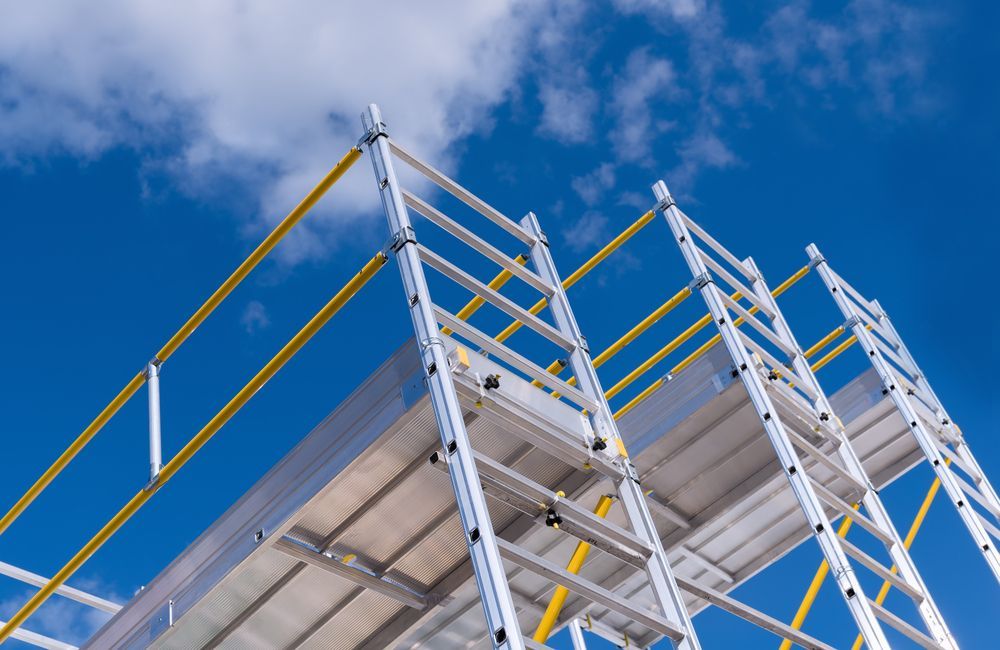 A Large Building Is Being Built With Scaffolding Against A Sunset Sky — Triple S Scaffolding In Port Macquarie, NSW
