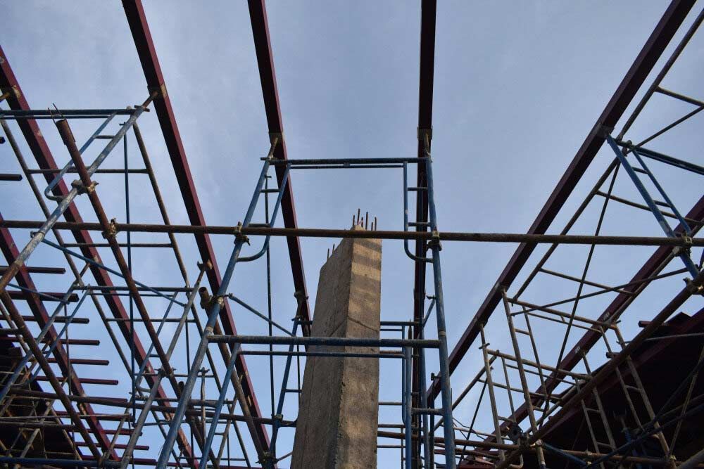 Looking Up At A Scaffolding Structure With A Chimney In The Background — Triple S Scaffolding In Port Macquarie, NSW