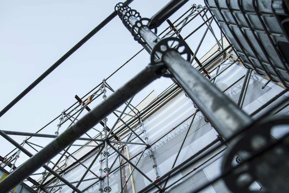 Looking Up At A Scaffolding On The Side Of A Building — Triple S Scaffolding In Forster, NSW