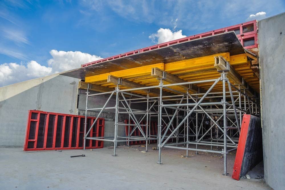 A Building Under Construction With Scaffolding And A Blue Sky In The Background — Triple S Scaffolding In Port Macquarie, NSW