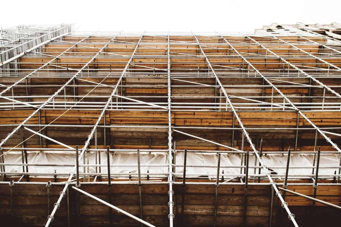 A large building under construction with a lot of scaffolding on it — Triple S Scaffolding In Port Macquarie, NSW