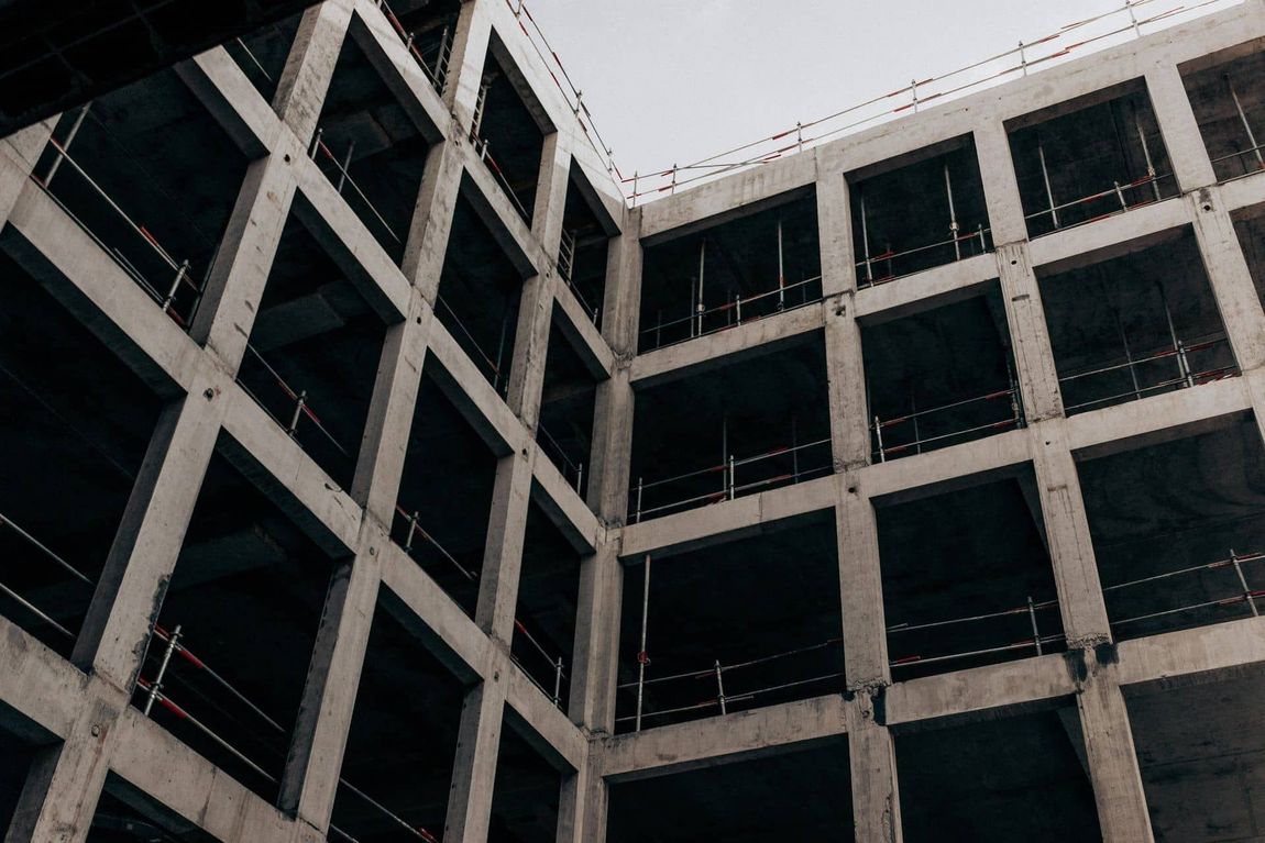 A Building Under Construction With A Lot Of Windows And Scaffolding — Triple S Scaffolding In Port Macquarie, NSW