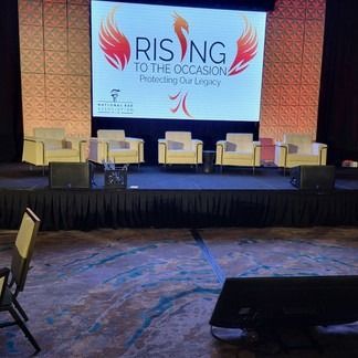 Stage setup with a large screen displaying 