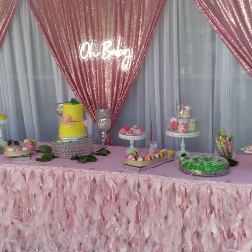 Pink baby shower dessert table with 