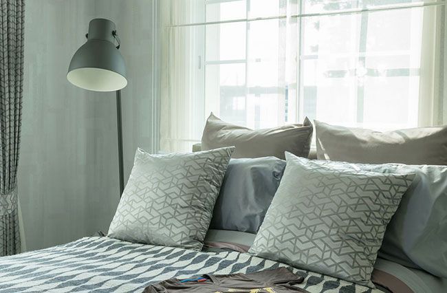 luxurious, modern gray and white bedroom