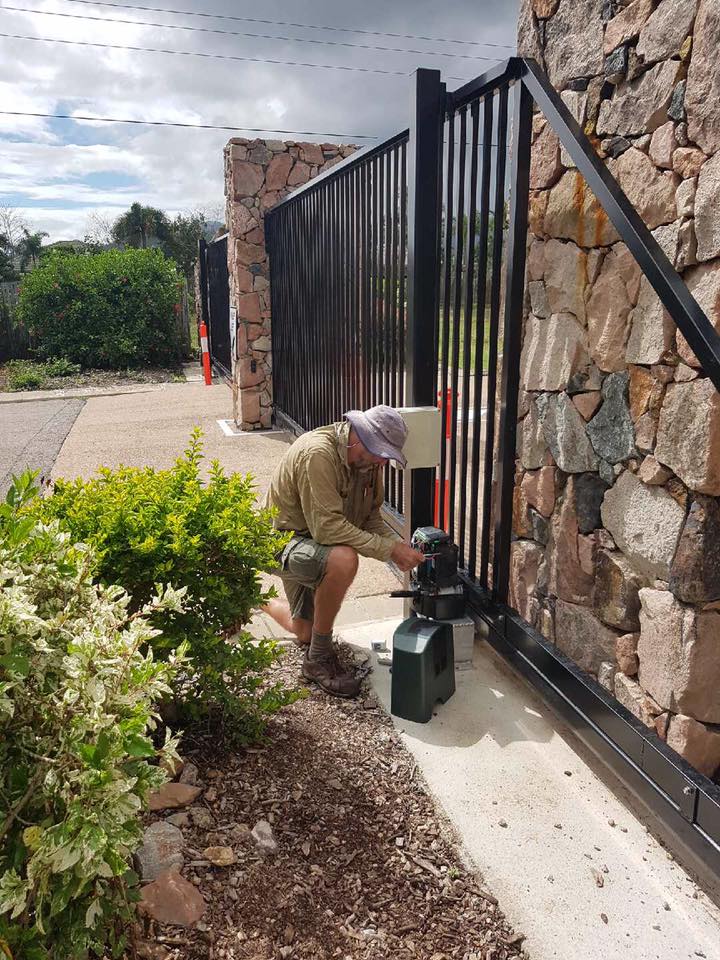 Worker Repairing Automatic Gate — Gate-O-Matic In Kelso, QLD