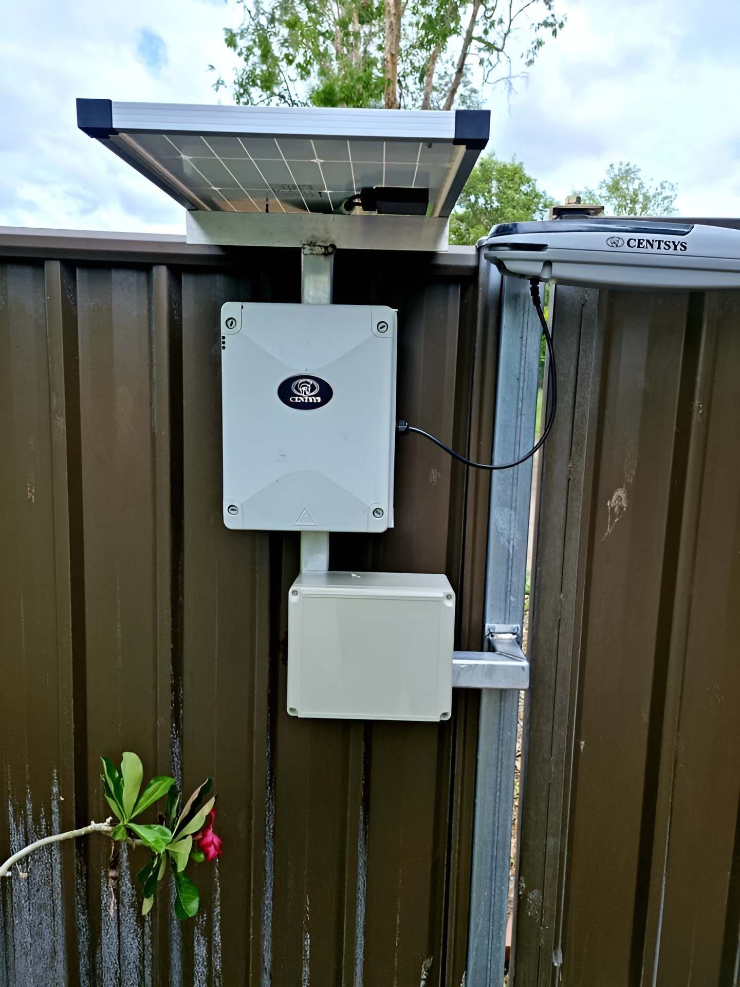 A Solar Panel is Mounted to the Side of a Fence — Gate-O-Matic In Kelso, QLD
