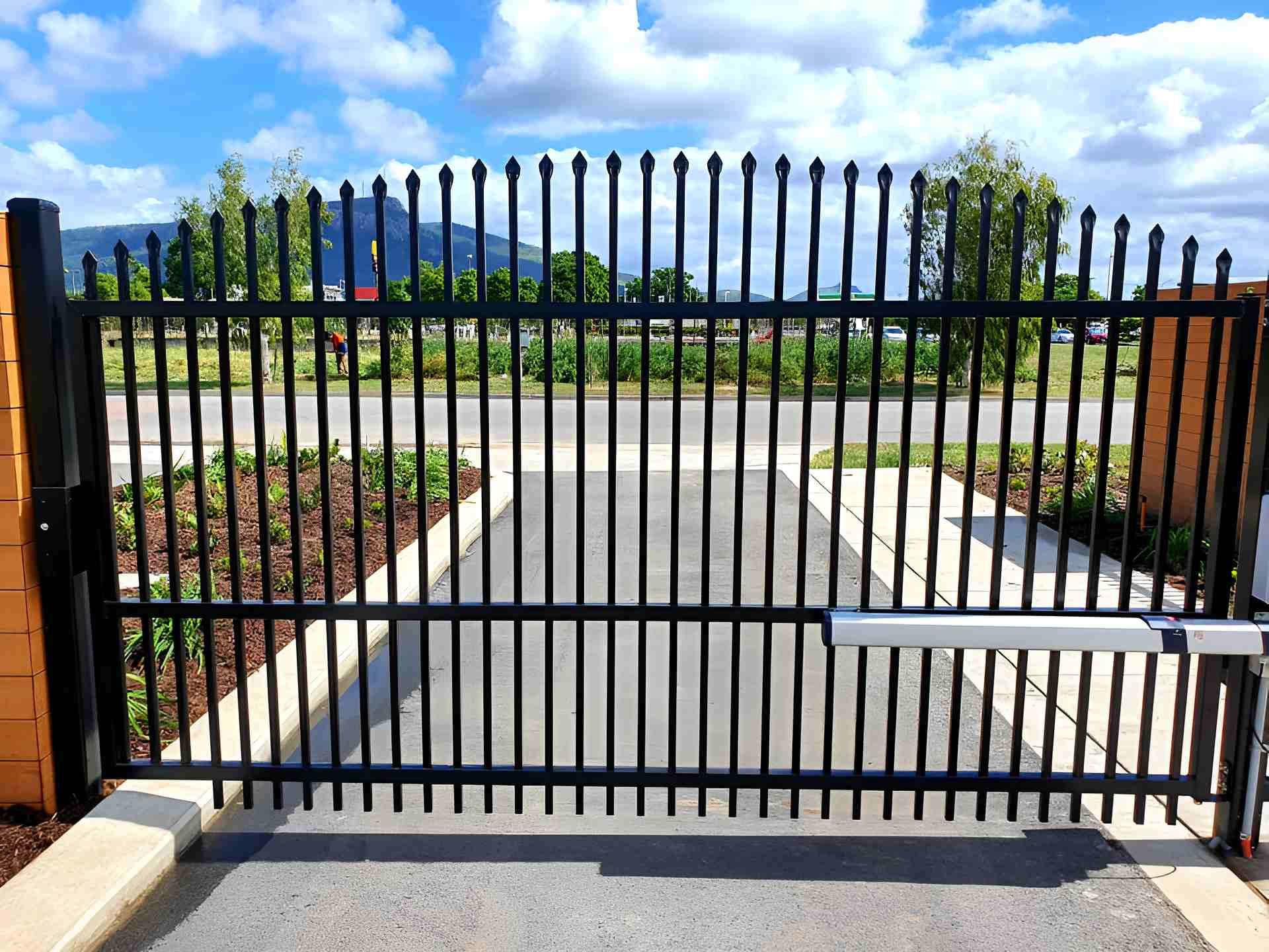 A Black Metal Gate is Open to a Driveway — Gate-O-Matic In Kelso, QLD