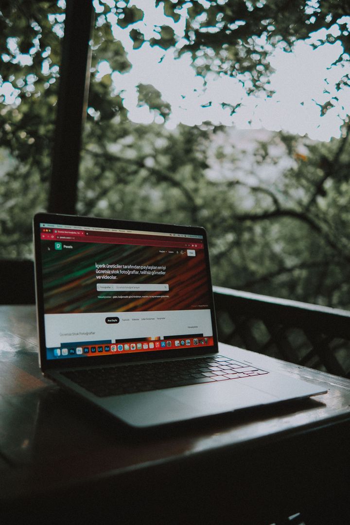 a laptop showing the beginning stages of a new website