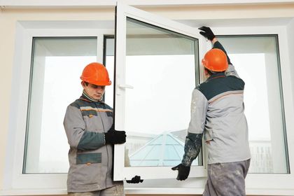 Two workers installing window - Window Manufactures and Wholesalers in Passaic, NJ
