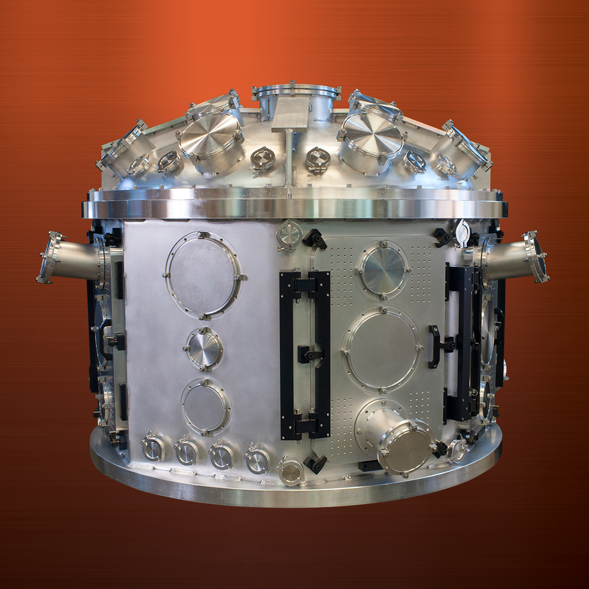 A metal cube with two holes in it