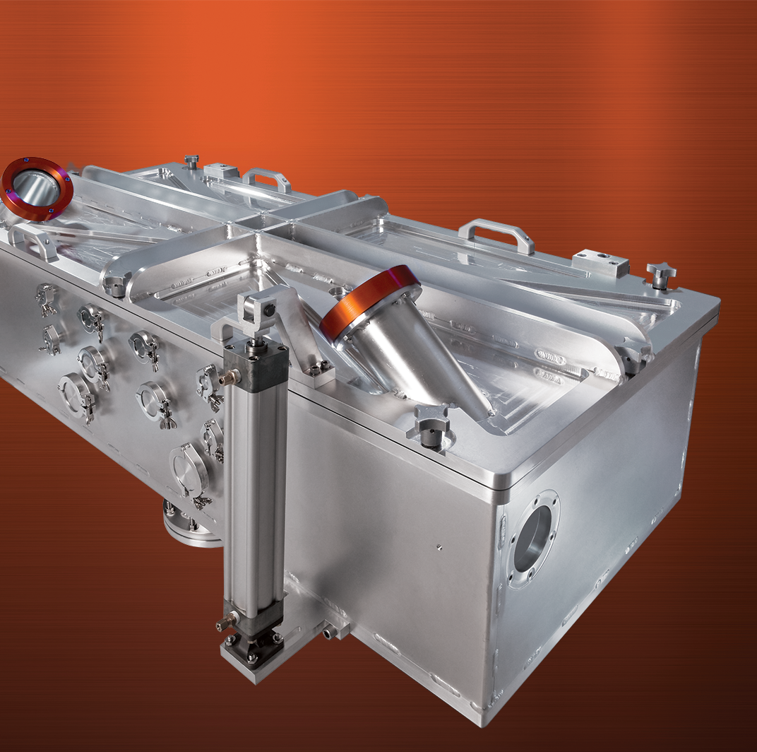 A metal cube with two holes in it