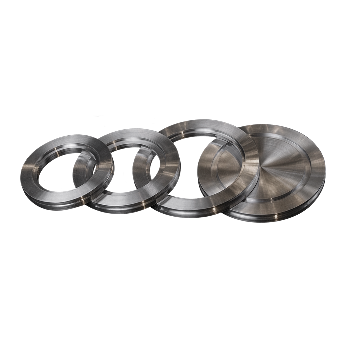 A set of four metal rings on a white background