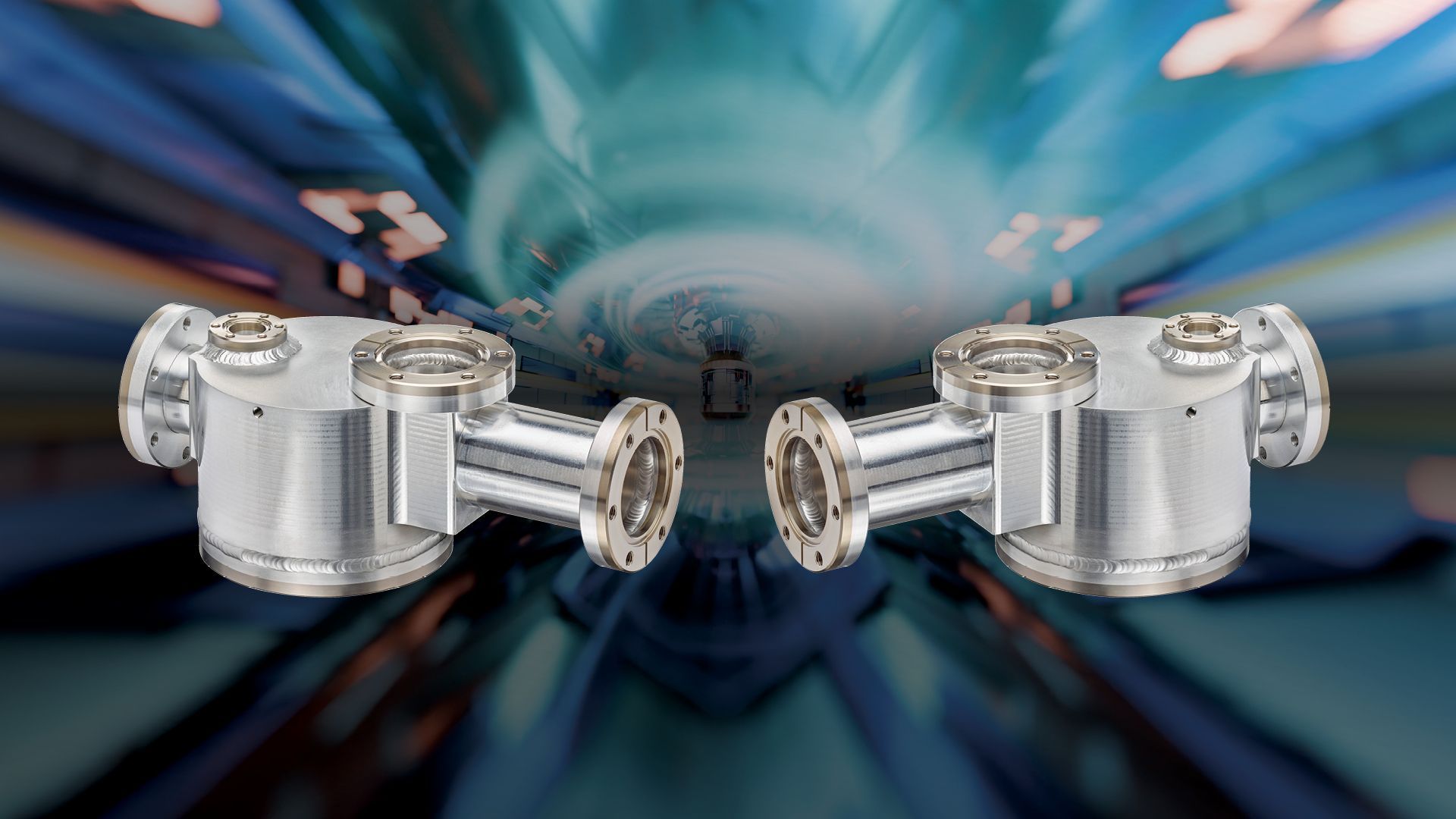 Two aluminum vacuum chambers with titanium flanges shown in front of a simulated particle accelerator background.
