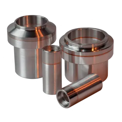 Three bimetal Al-SS fittings in different sizes and configurations are cylinder shaped with larger diameter endfaces.