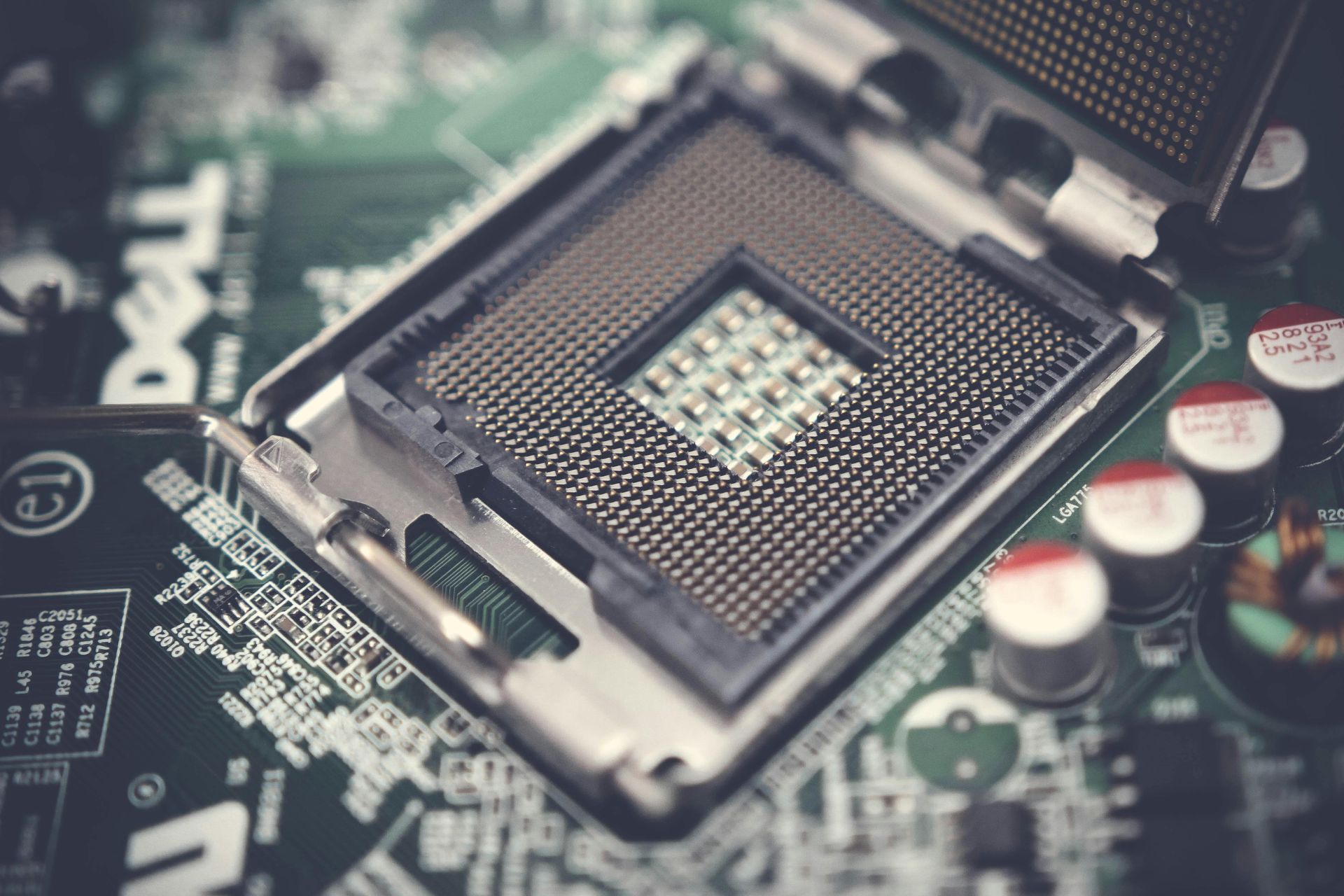 A close up of a cpu socket on a motherboard.