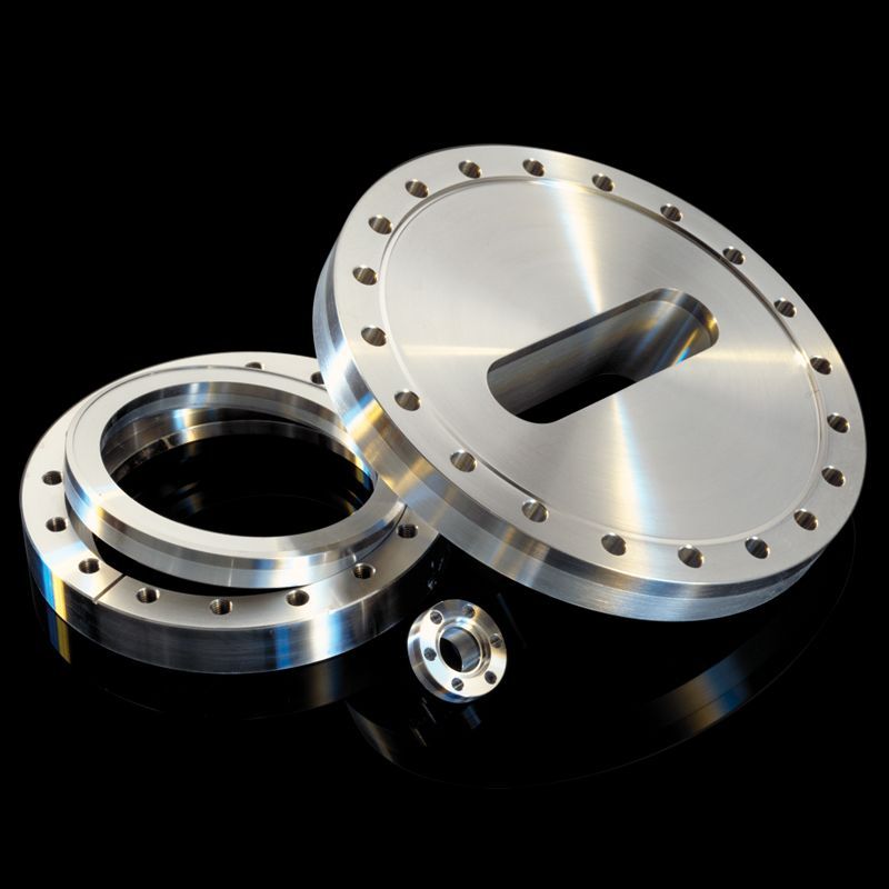 A stainless steel flange with a hole in the middle