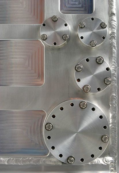 A close up of a metal surface with holes in it