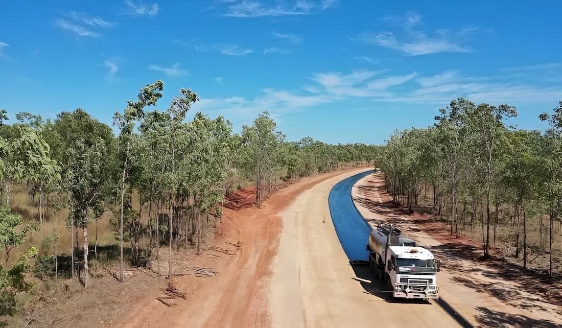 A Truck Bitumen Sealing an Outback Road — F & J Bitumen Services in Adelaide River, NT