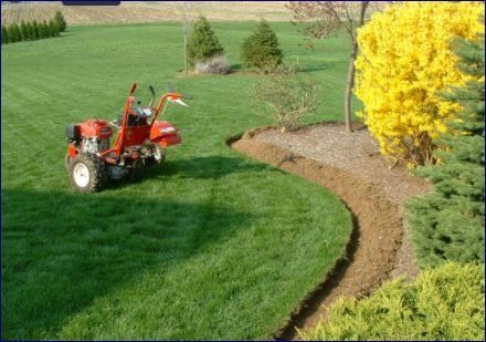Wolfy's Landscaping doing what they do best with regular lawn maintenance, pine needeling , mulching and trenching Winston-Salem, Clemmons and surround areas  most iconic landscapes for homes, commercial properties, and everything in between.
