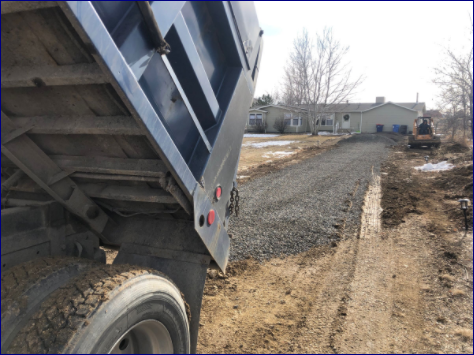Dump Truck Hauling and Delivering Dirt