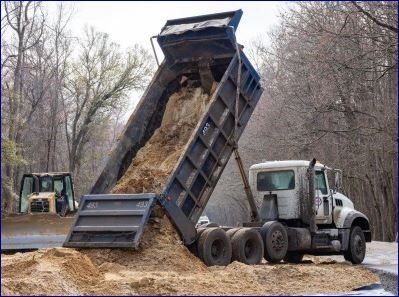 Dump Truck Delivering and Dumping Sand