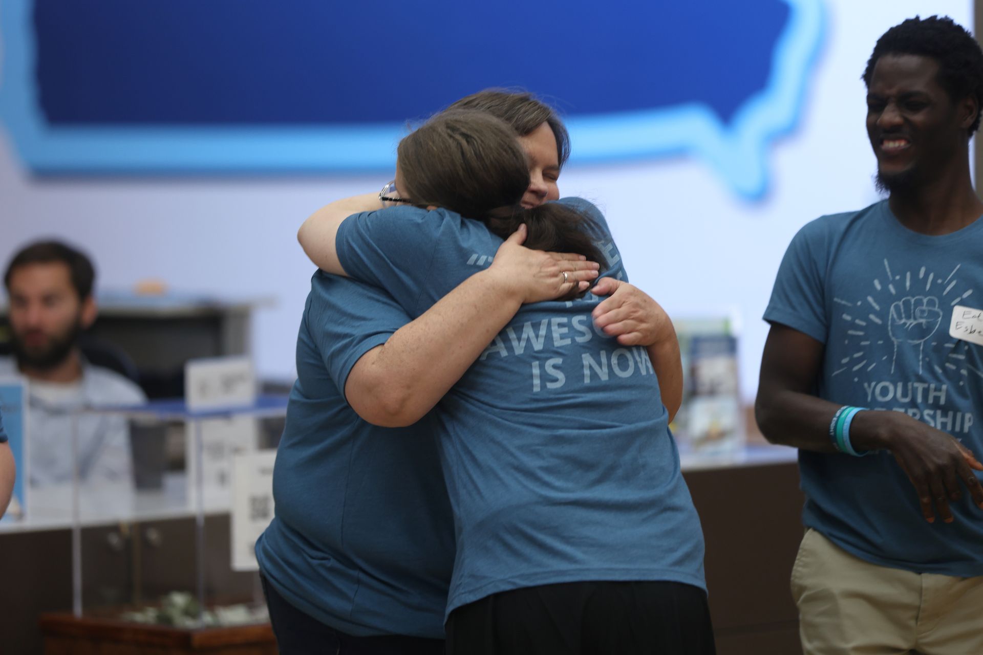 Two YLA graduates hugging