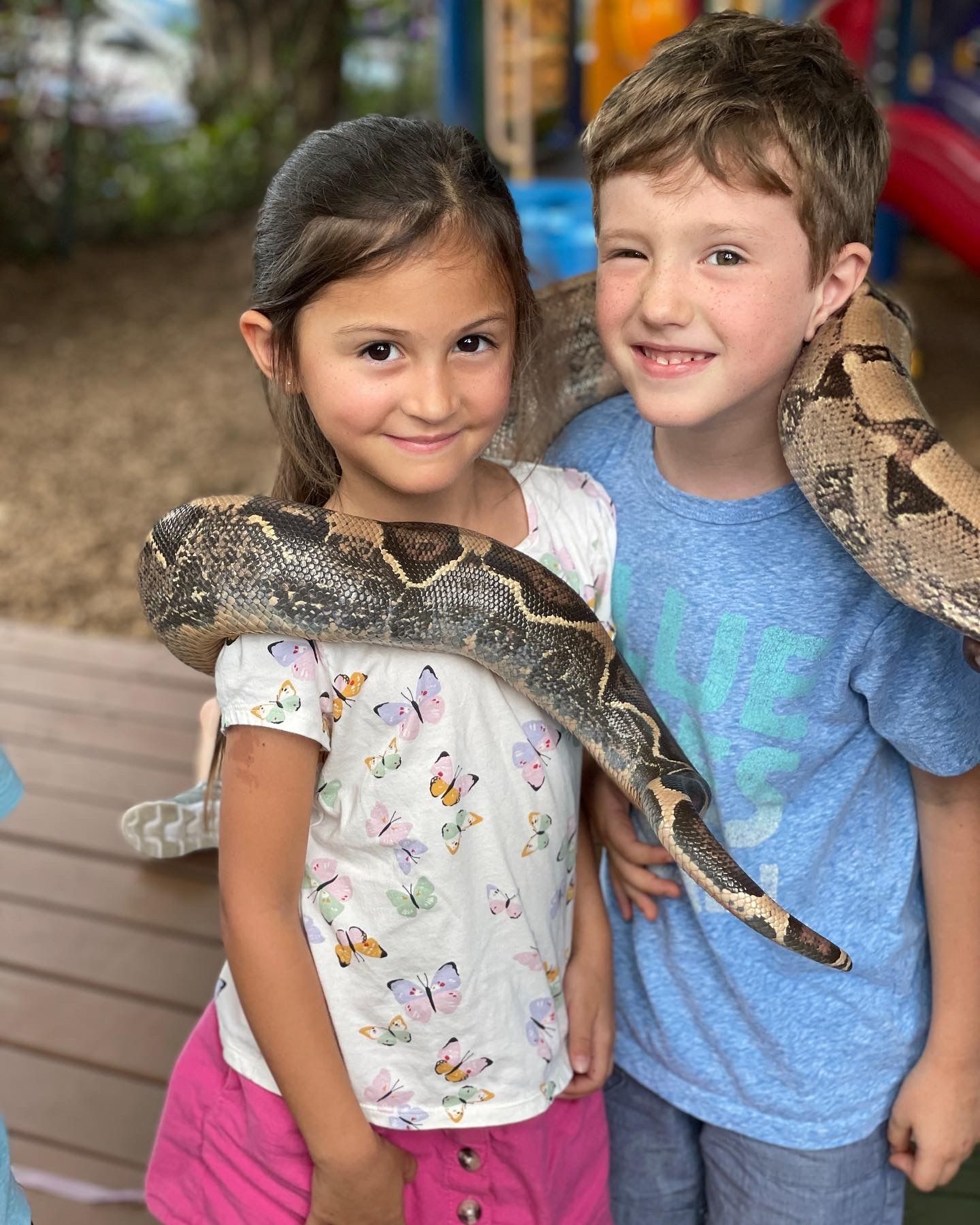 Montessori children and guide in a lesson activity