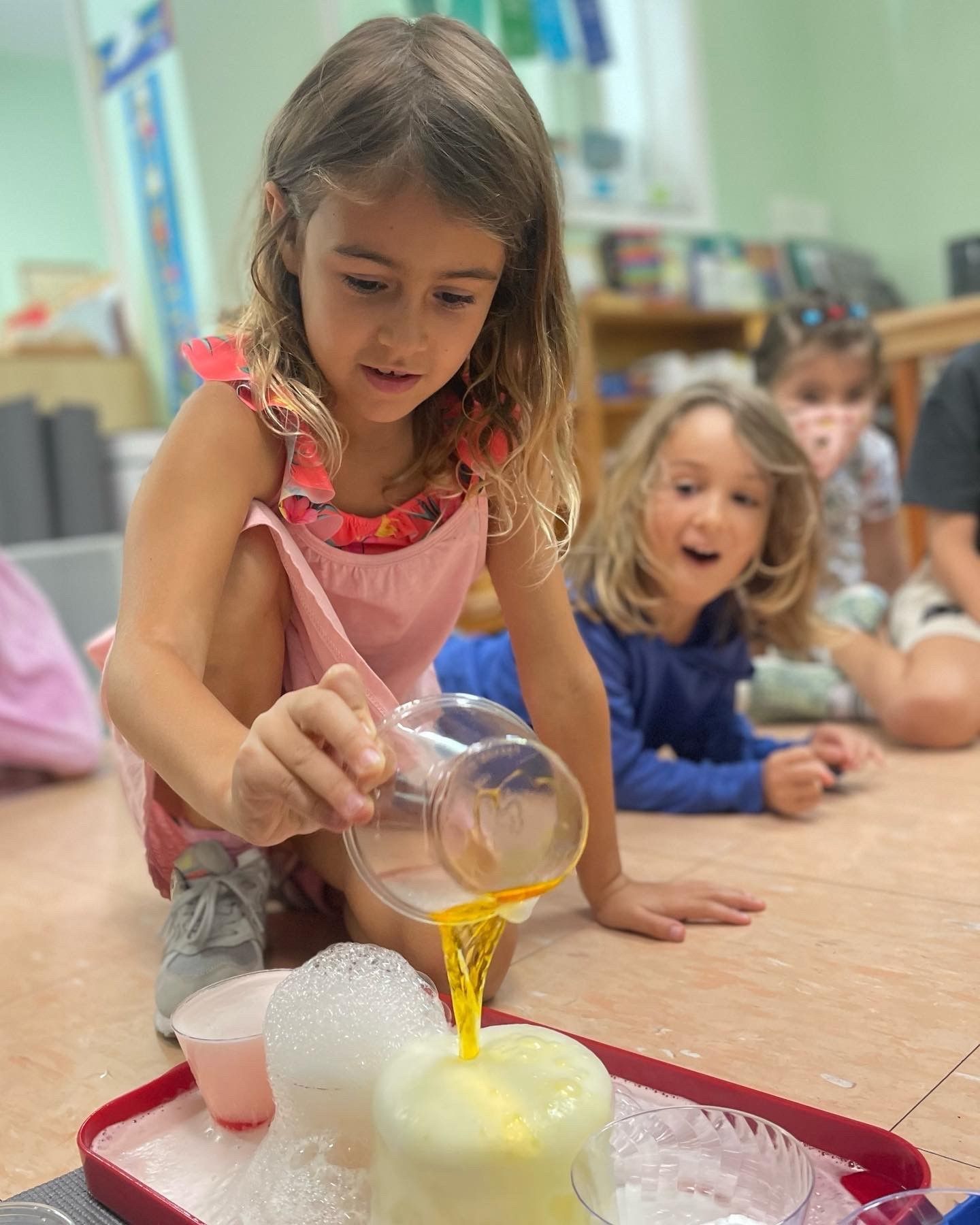Montessori child engaged in a science activity