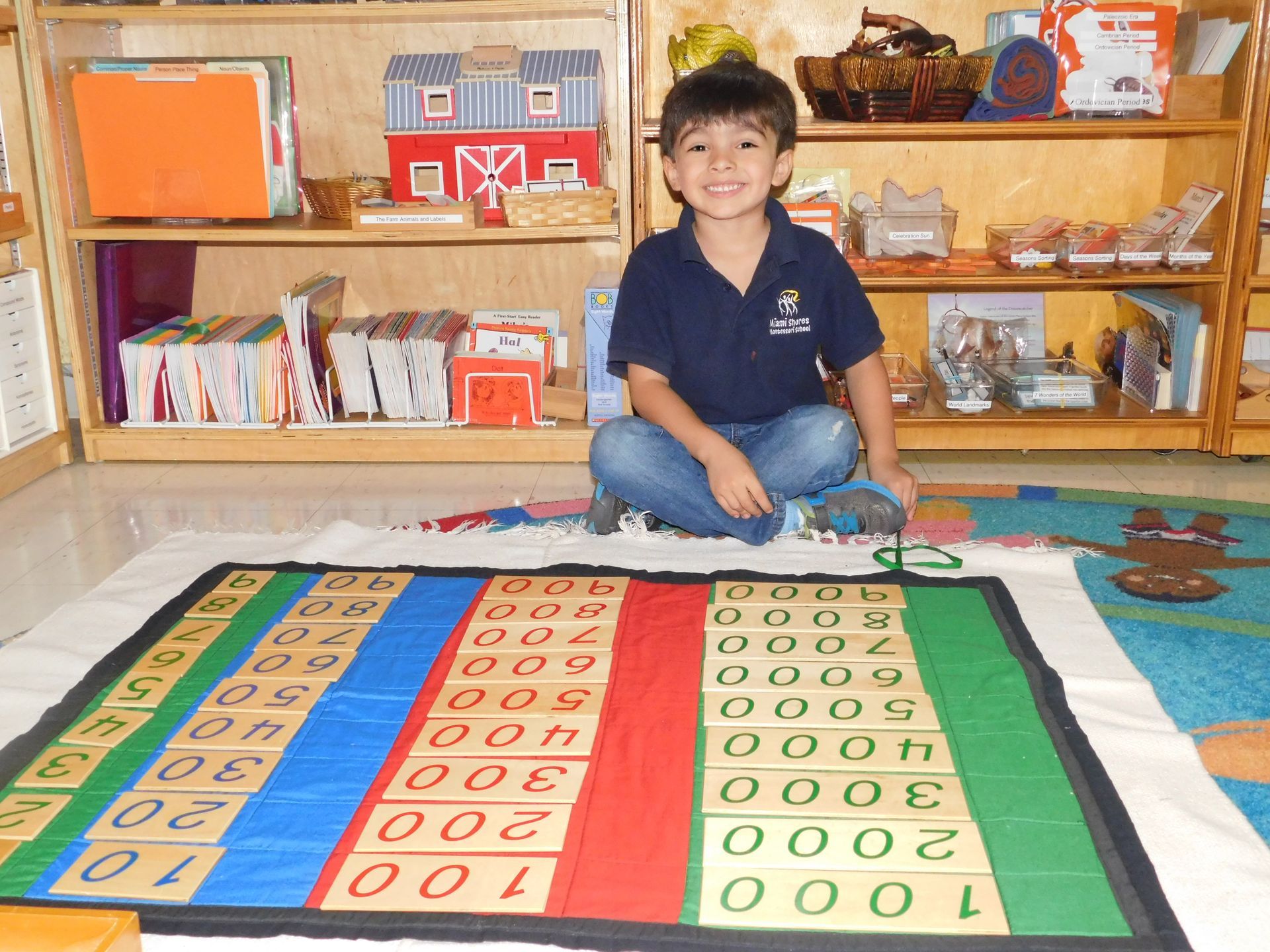Montessori child working with math materials