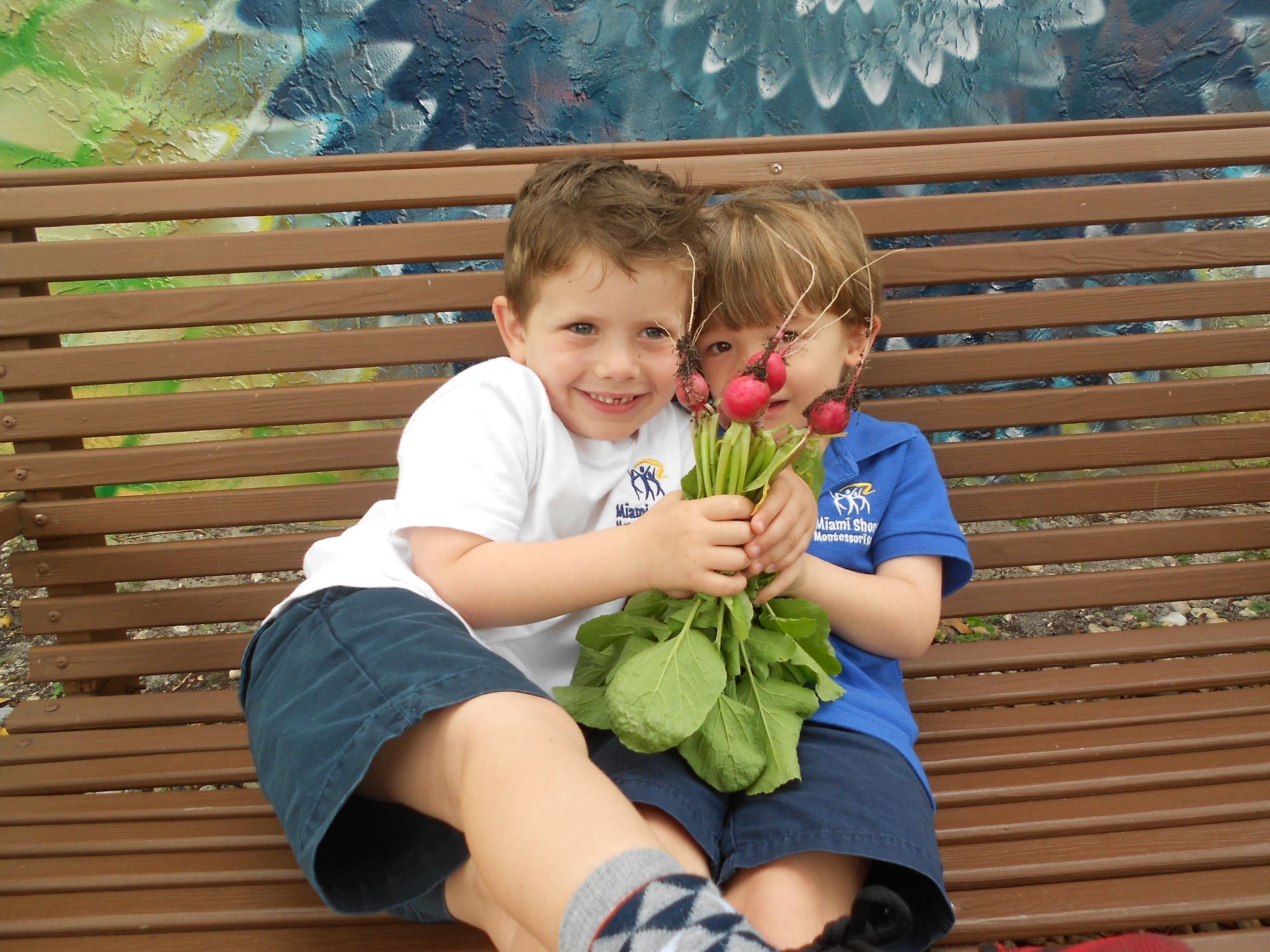 A Montessori elementary child is sitting at a table in a classroom working with materials