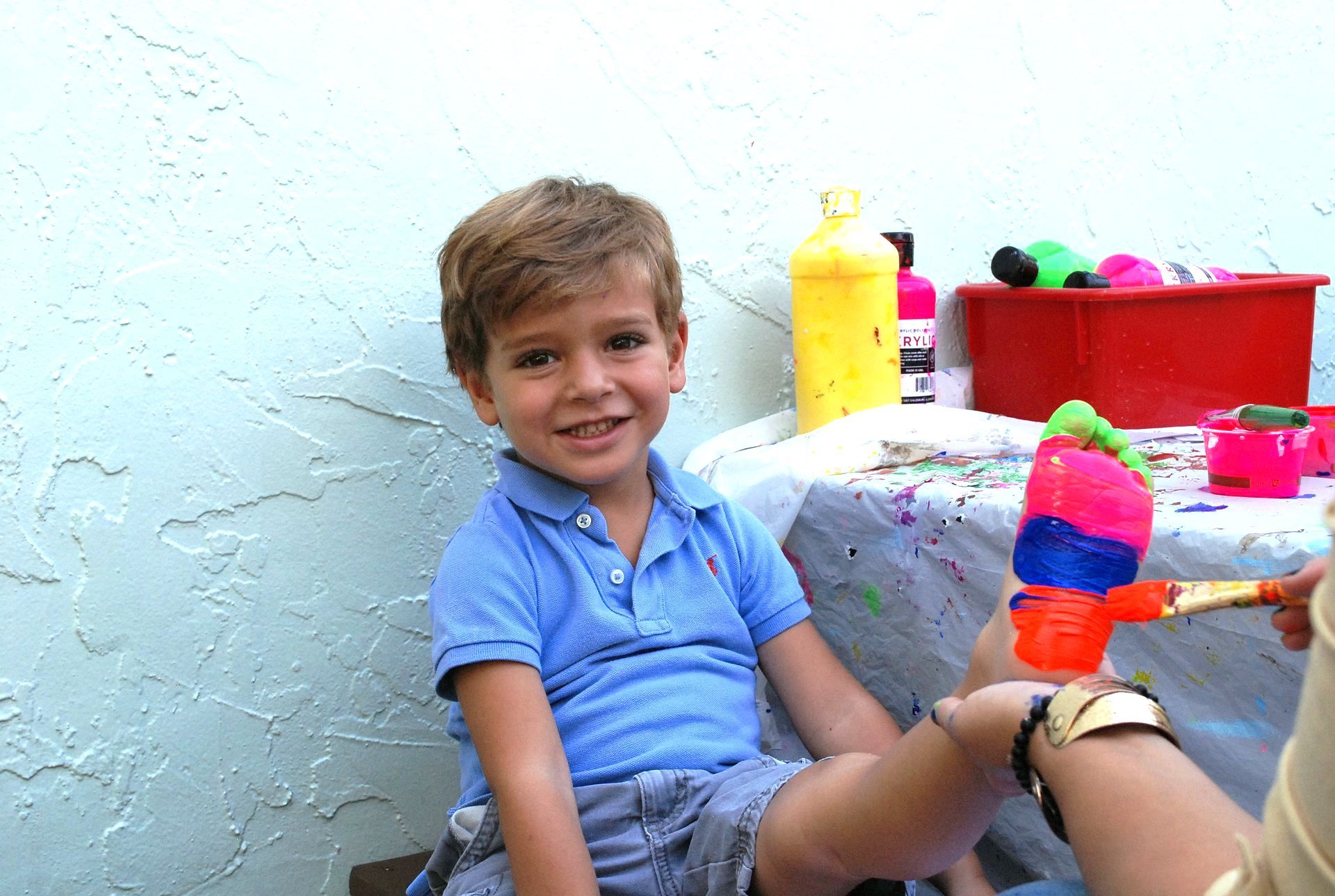 Montessori child with a painted foot