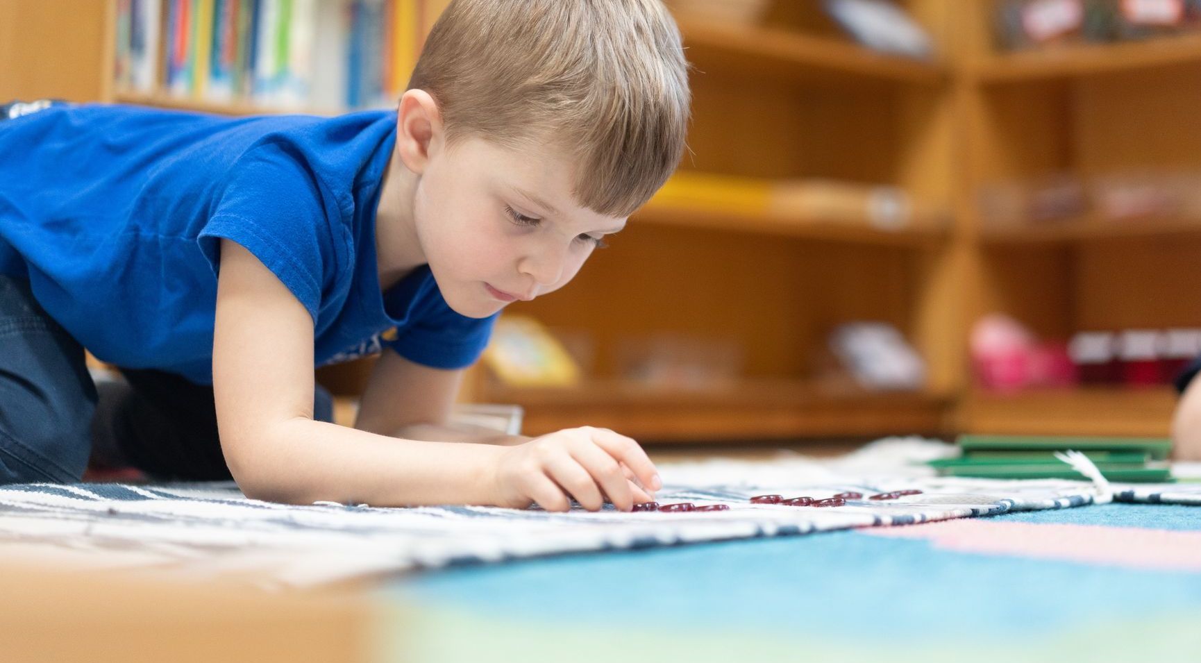 Montessori child working with math materials